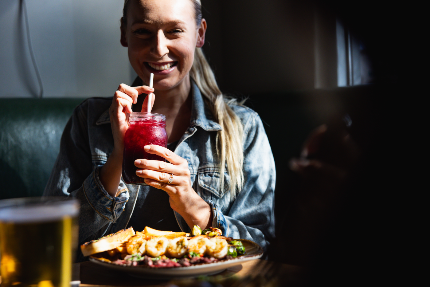 Happy woman enjoying Urban Plates meal