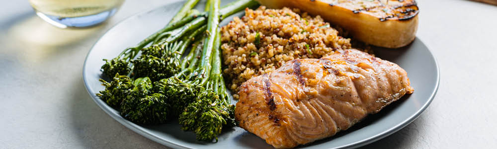 Grilled sustainable salmon plate with sides