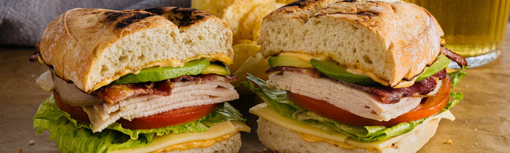 Turkey avocado club sandwich with bacon