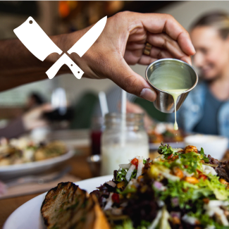 Dressing being poured on Salad